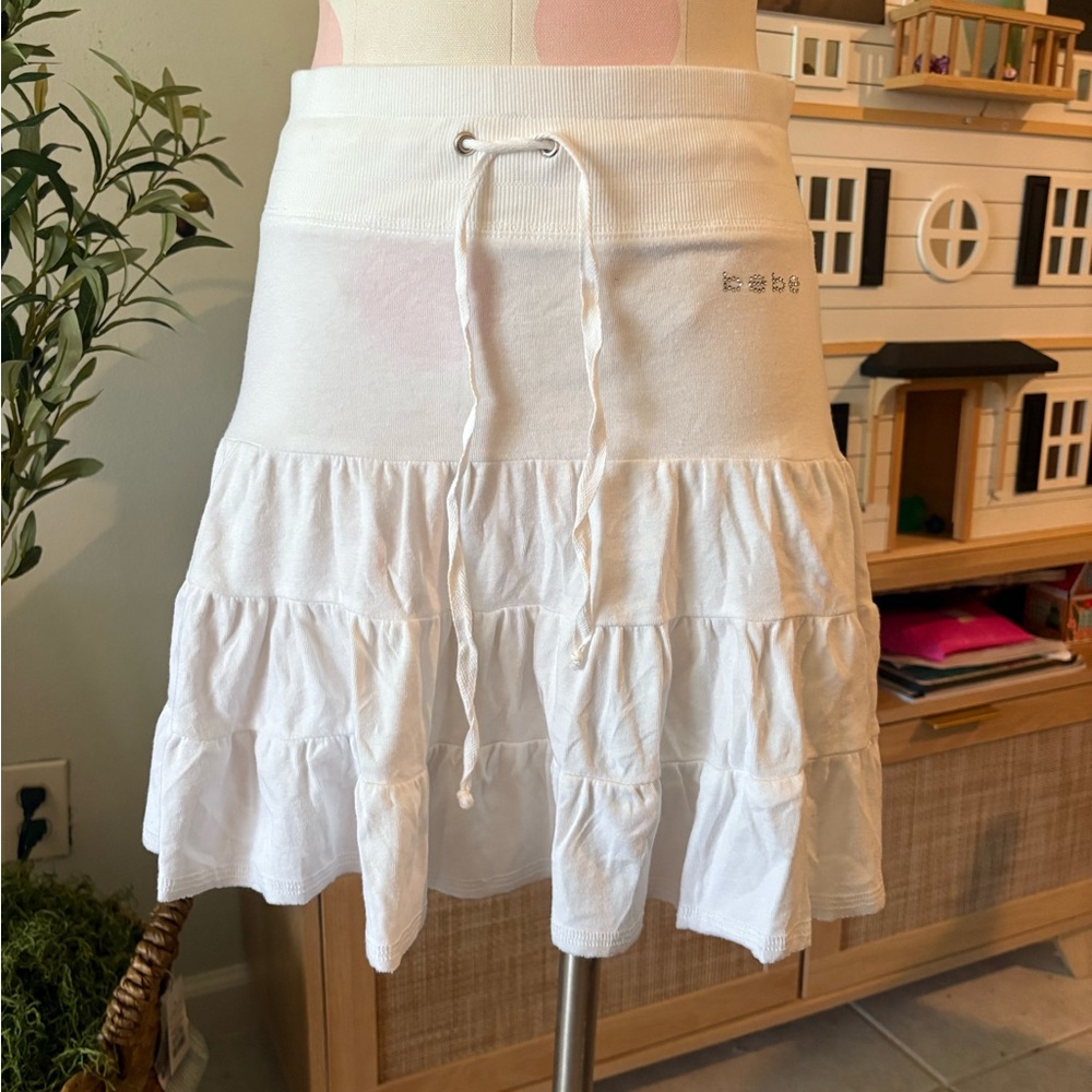 Bebe White Tiered Mini Skirt with Tie Front Crystal Logo